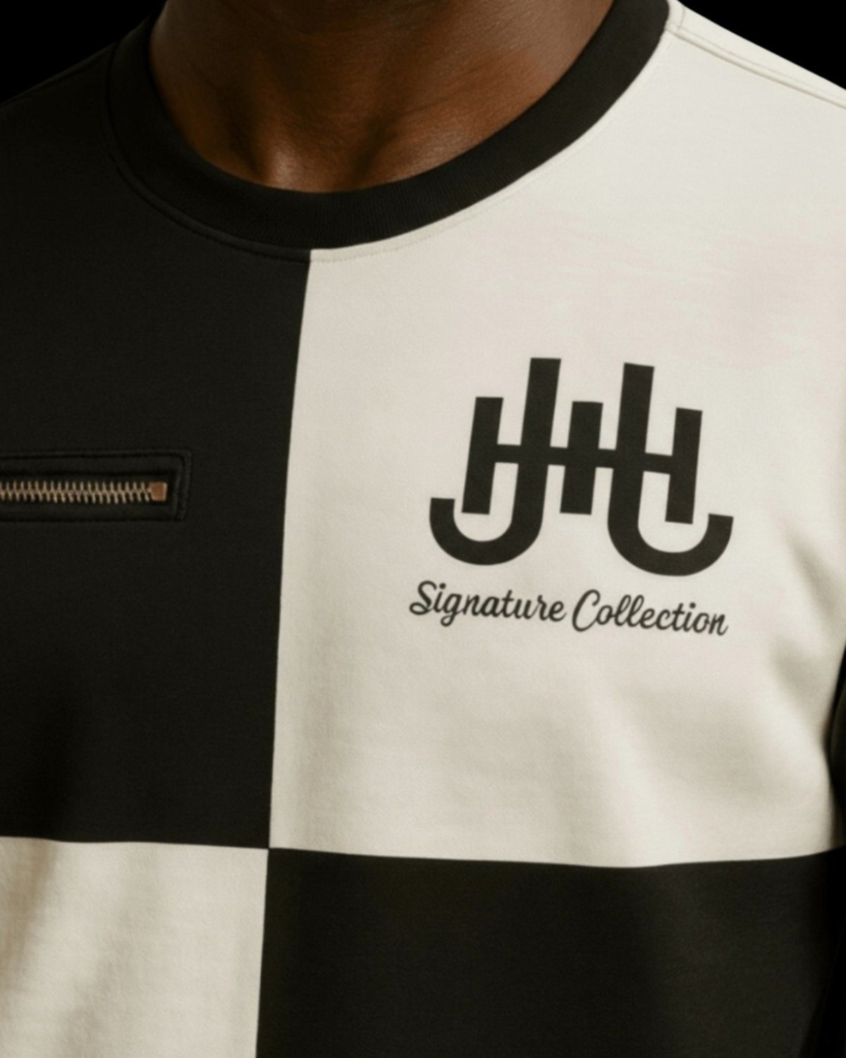 The Alban Tee logo and zipper detail